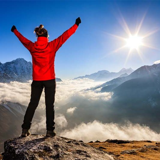 Person overlooking a broad landscape, representing thoughtful planning after an inheritance or sudden wealth event.